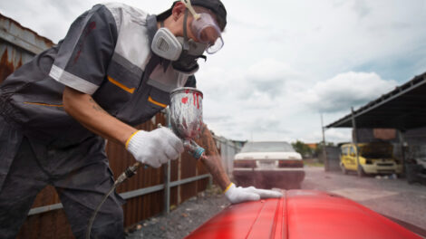 medium-shot-man-painting-car-door