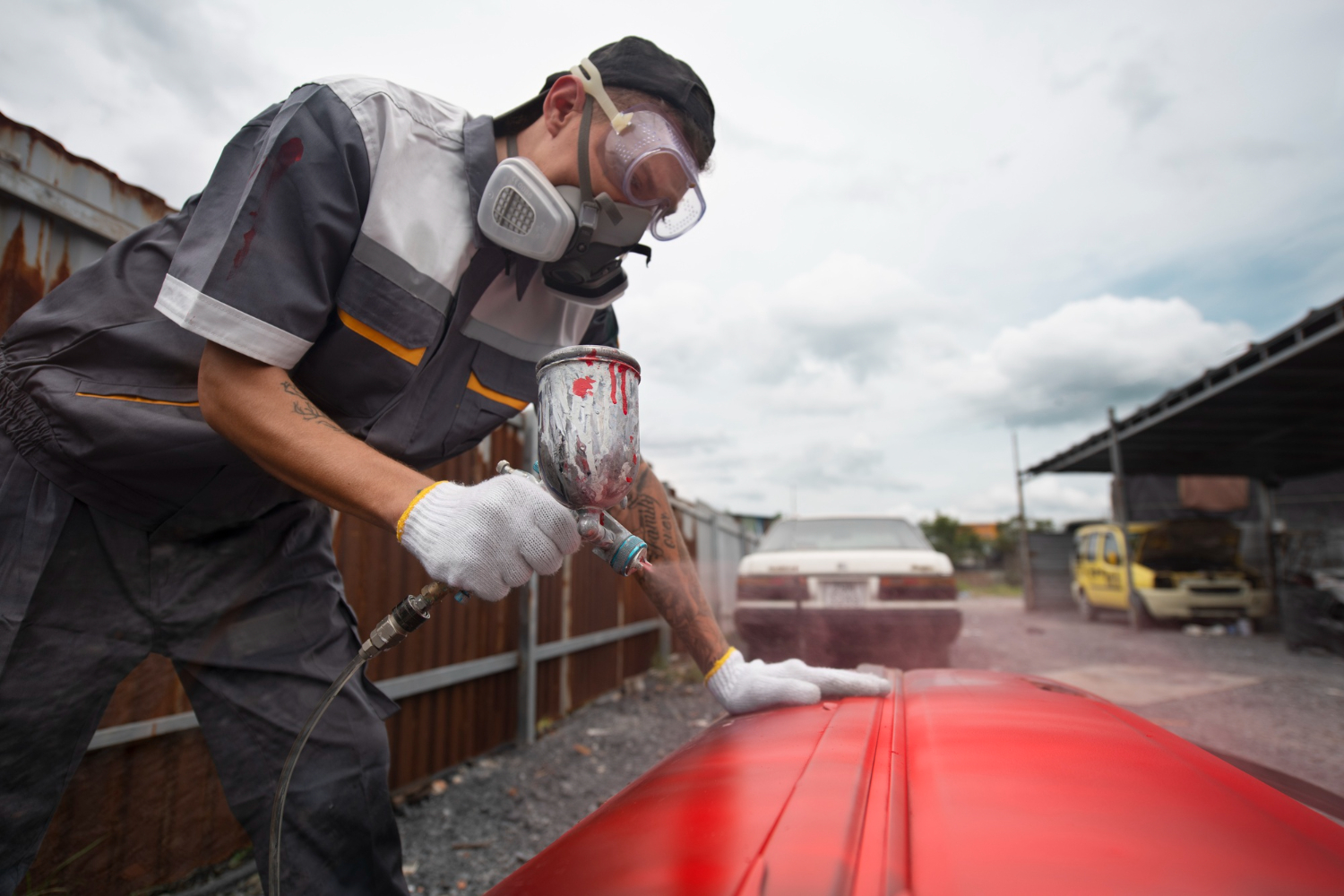 medium-shot-man-painting-car-door