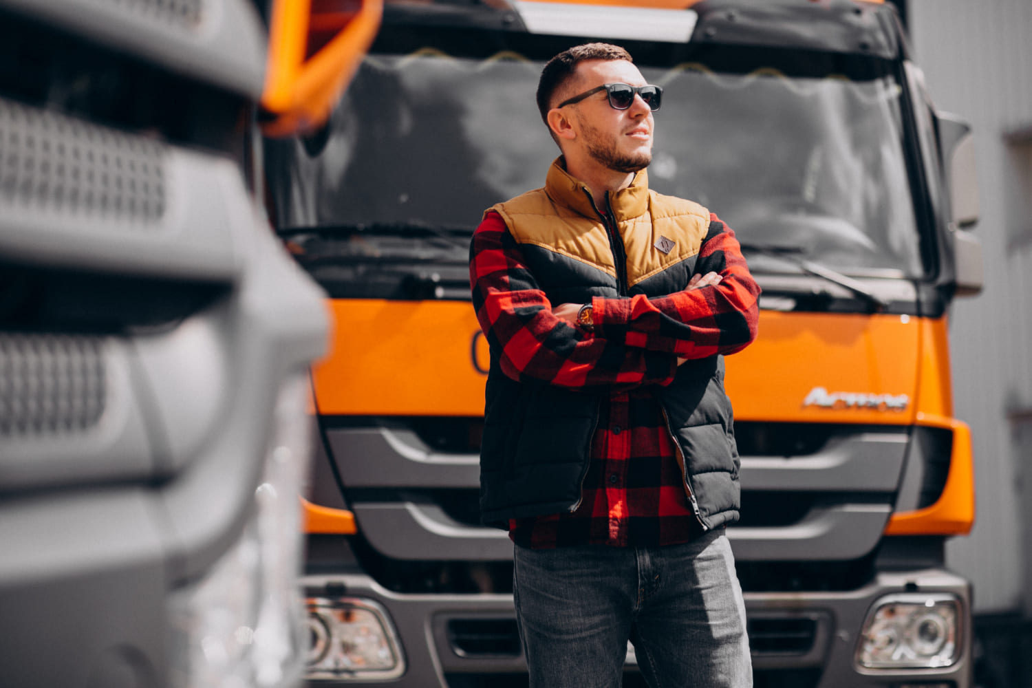 handsome-man-truck-driver-standing-by-truck