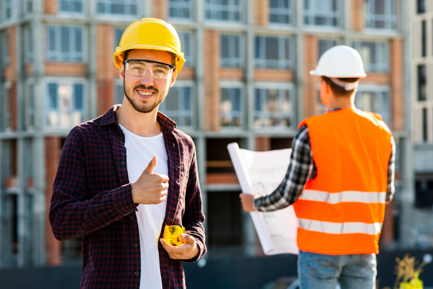 medium-shot-portrait-smiling-architect-looking-camera