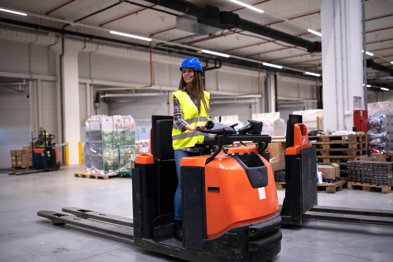 factory-worker-protective-suit-with-hardhat-driving-forklift-1-1